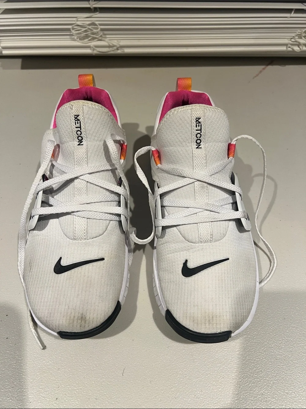Nike White Metcon Training Shoes with Black Swoosh and Pink/Orange Pull Tabs